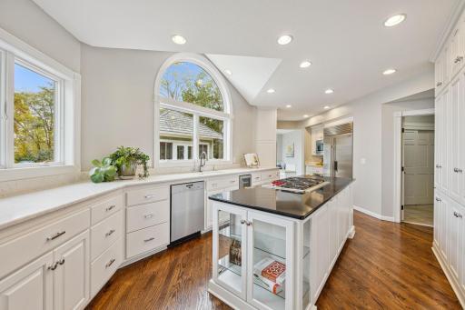 Kitchen flows into back hall entry to garage/mud area to the breakfast nook/Sunroom.