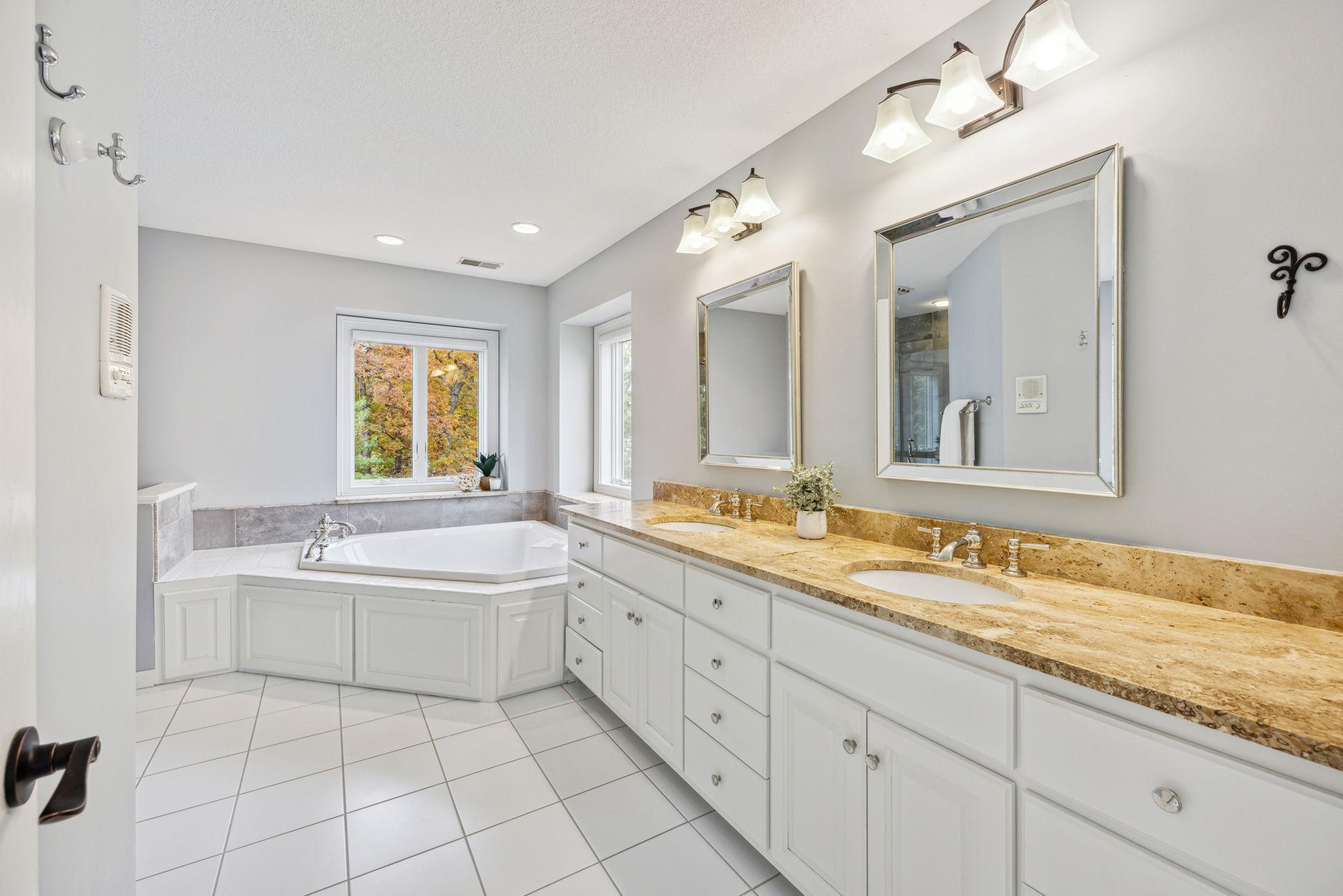 Primary bath has 2 sinks, jetted tub and large shower.