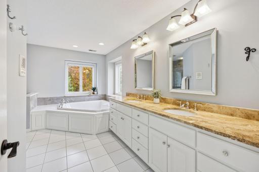 Primary bath has 2 sinks, jetted tub and large shower.