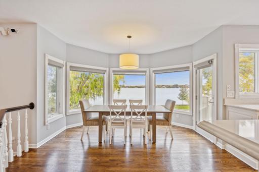 Dining area has bay window to enjoy the panoramic view of the lake.