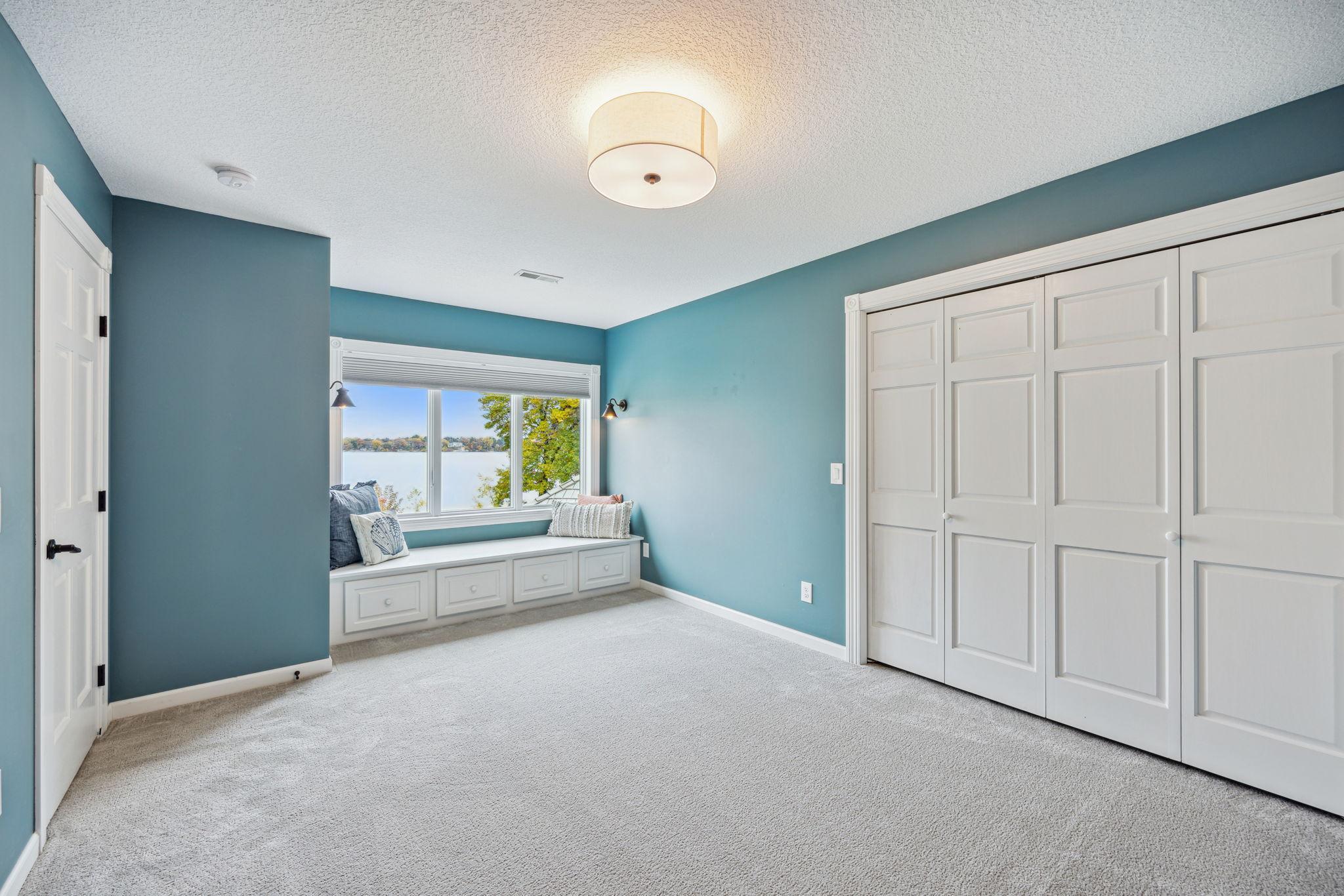 4rth bedroom has the ideal bench to soak in the sun and read a book and enjoy the lakeview.