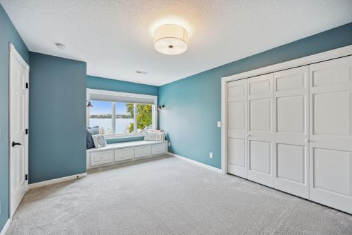4rth bedroom has the ideal bench to soak in the sun and read a book and enjoy the lakeview.