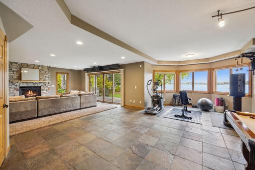 Slate floors and workout area, or game table area could be in the bay with lake views.