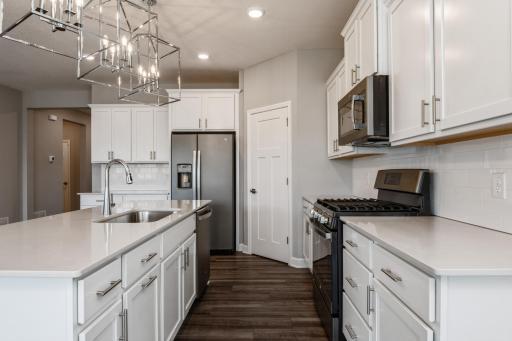 Ample storage in perimeter and island.