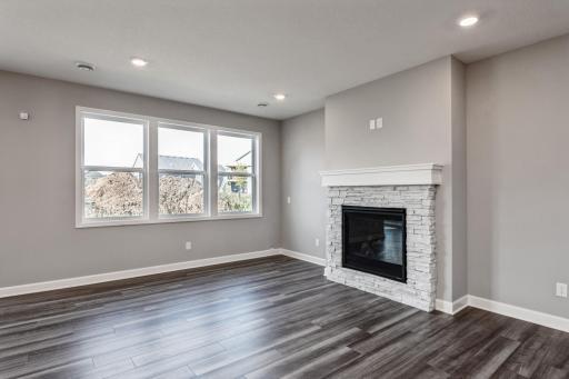 Gas fireplace plays well with trim, flooring, and cabinet color.