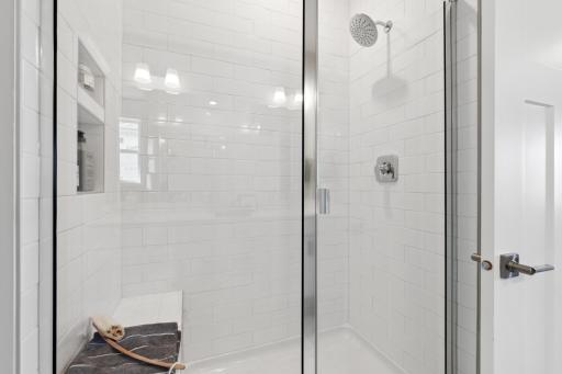 Gorgeous shower in the owner's suite bath. (Photo of decorated model, actual home's finishes may vary slightly)