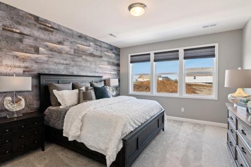 Find your retreat in this stunning owner's suite. Enjoy the exclusivity of a private bath and huge walk-in closet. (Photo of decorated model, actual home's finishes may vary slightly)