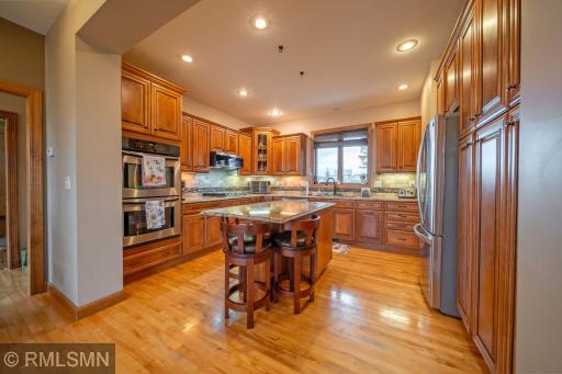 Gourmet kitchen with Cambria countertops and SS appliances.