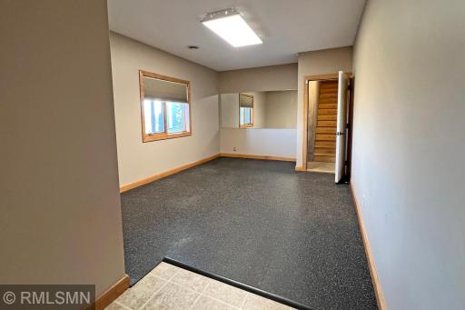 Workout room with separate entrance to the garage from the lower level!