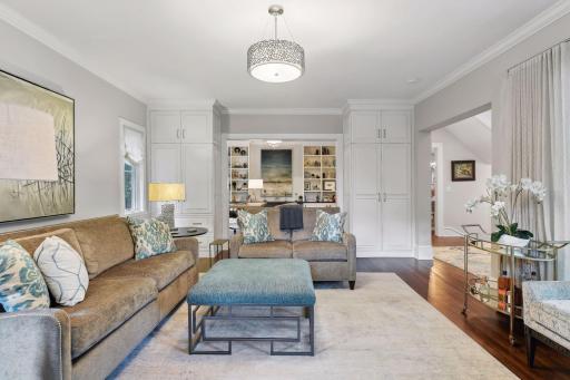 Spacious rooms, wide doorways, and a circular flow make entertaining large or small groups a breeze. Built-in cabinets flank the entrance to the main level den/office.