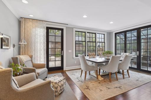Comfortable sitting area and informal dining within the kitchen for daily meals, connectivity to the kitchen, and additional entertaining space with convenient access to the patio and porch.