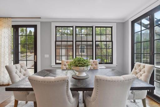 Charming views into the back patio area and thoughtfully designed garage.