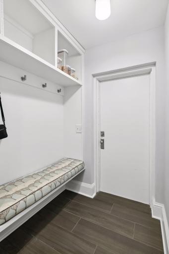 Convenient main level mud room adjacent to the attached garage. A second main level powder room is located just off of the back hallway near the mud room.