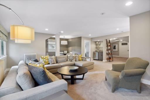 The third floor offers plenty of space for a seating arrangement for movie nights, a game table area, bar area with a beverage cooler, full bath, excellent storage, and a play/craft room.