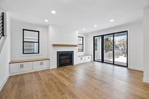 Light a bright living room with plenty of windows for natural light. Pictures of previously built house.