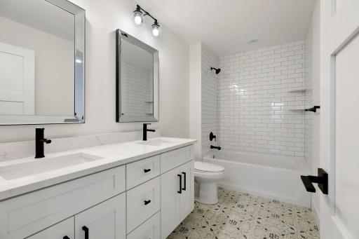 2 upper level bedrooms share jack and jill bathroom. Pictures of previously built house.