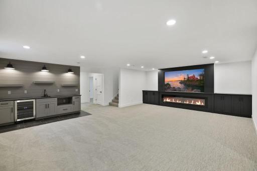Mix your favorite cocktail, serve beer or wine to friends while watching game on big screen! Lower level is build for entertaining. Pictures of previously built house.