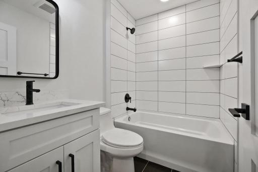 Lower level full bathroom. Pictures of previously built house.
