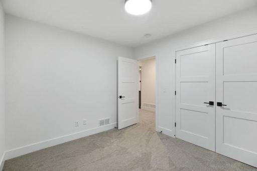 Lower level guest (4th) bedroom. Pictures of previously built house.