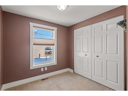 Third main floor bedroom also offers plush new carpet, tons of natural sunlight streaming through large windows and tons of closet space!