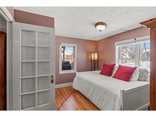 The second bedroom features gleaming hardwood floors and tons of natural light!