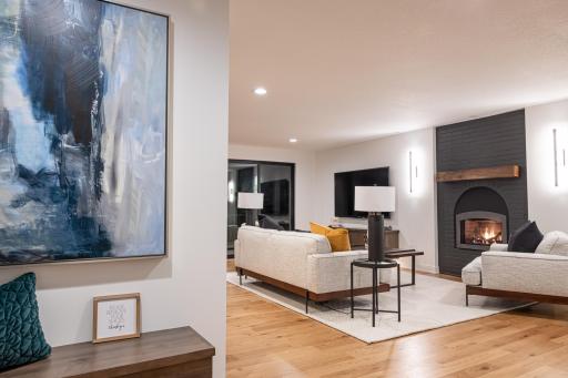 Upon entering you are welcomed by a beautiful and cozy living room and wet bar.