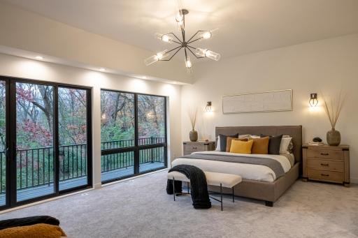 The master suite has a private deck, walk-in closet, private laundry and gorgeous bath with an oversized shower.