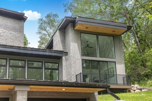 The heavily wooded lot affords amazing privacy, natural light and nature views.