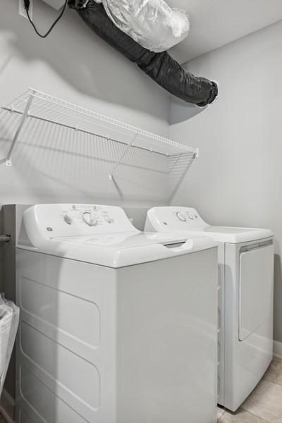 The washer and dryer are conveniently located upstairs next to the bedrooms. (Photo of a completed home, actual home's finishes may vary slightly)