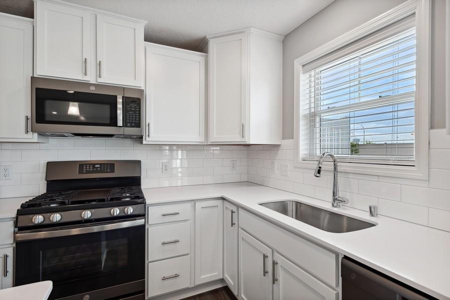 Imagine preparing a wonderful meal for dinner in this kitchen or entertaining friends and family over the weekend! (Photo of a completed home, actual home's finishes may vary slightly)