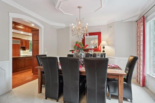 Entertainer's Formal Dining/Parlor for sharing a meal with family or hosting a dinner party with special guests. Beautiful chandelier & intricate molding adorn the room.