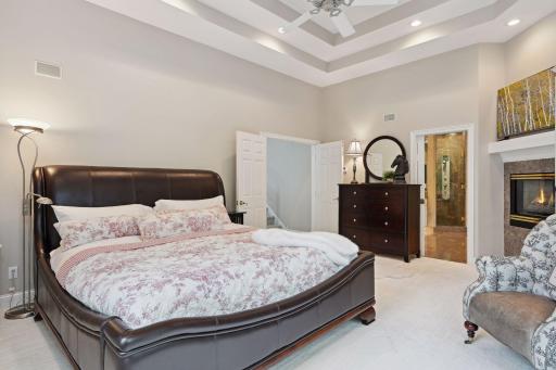 You are welcomed into your Owner's Suite by way of French doors. A romantic calm of soft tones and the ambiance of fireplace sets the mood for a restful evening.