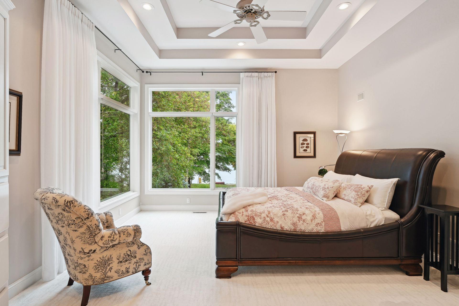 Well-Appointed Owner's Suite - An elegant, intimate retreat, privately situated on its own floor. Magnificent wall of windows draws in nature while capturing long views across the water. Press the snooze button a few more times.