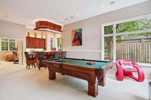 This recreation lounge was built for billiards & beverages. Walk out to back patio. Music flows through the house & outside with this multi-room sound system.