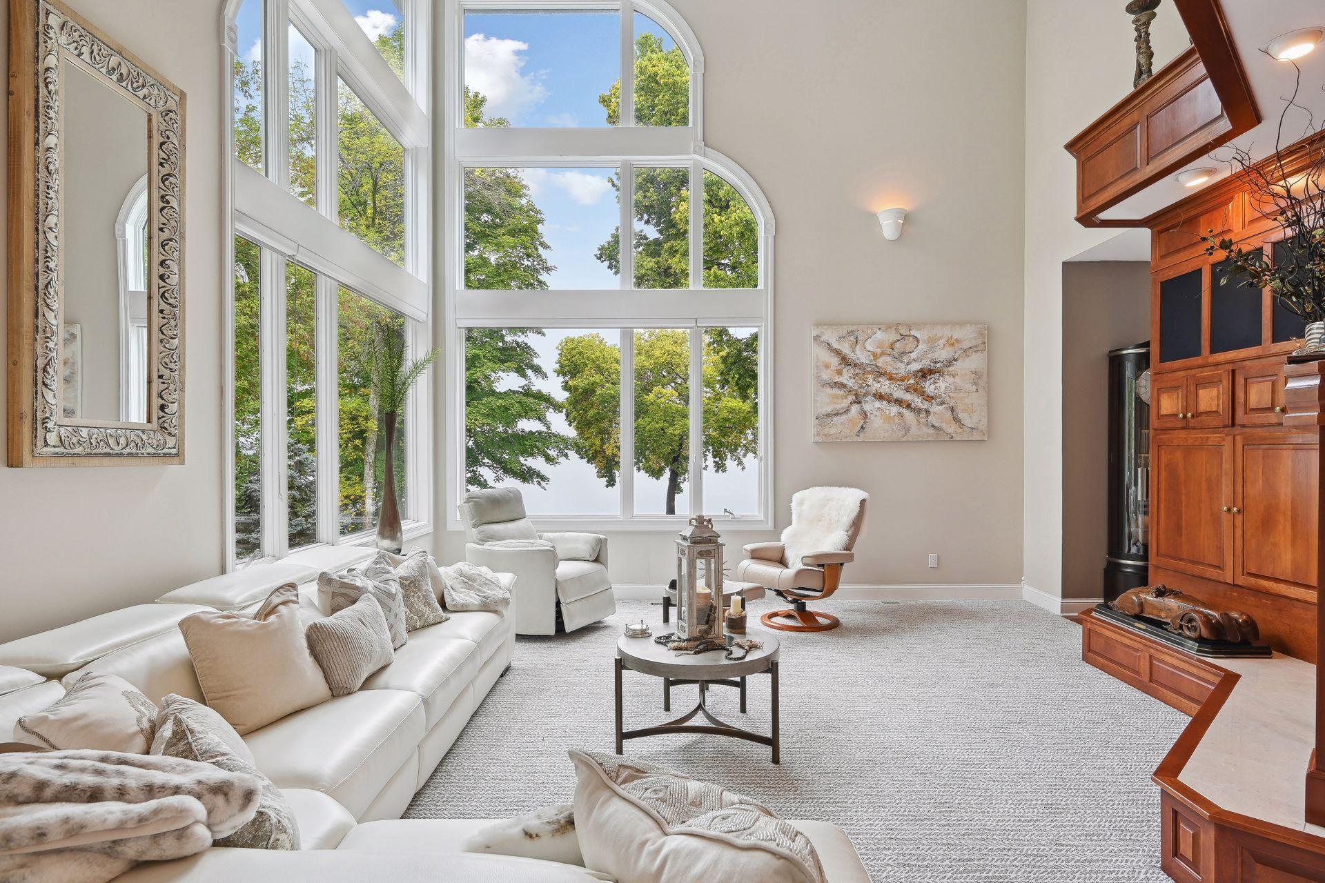 A masterpiece of design, luxury, & functionality that seamlessly integrates with the natural surroundings and capitalizes on the stunning beauty of the lake.