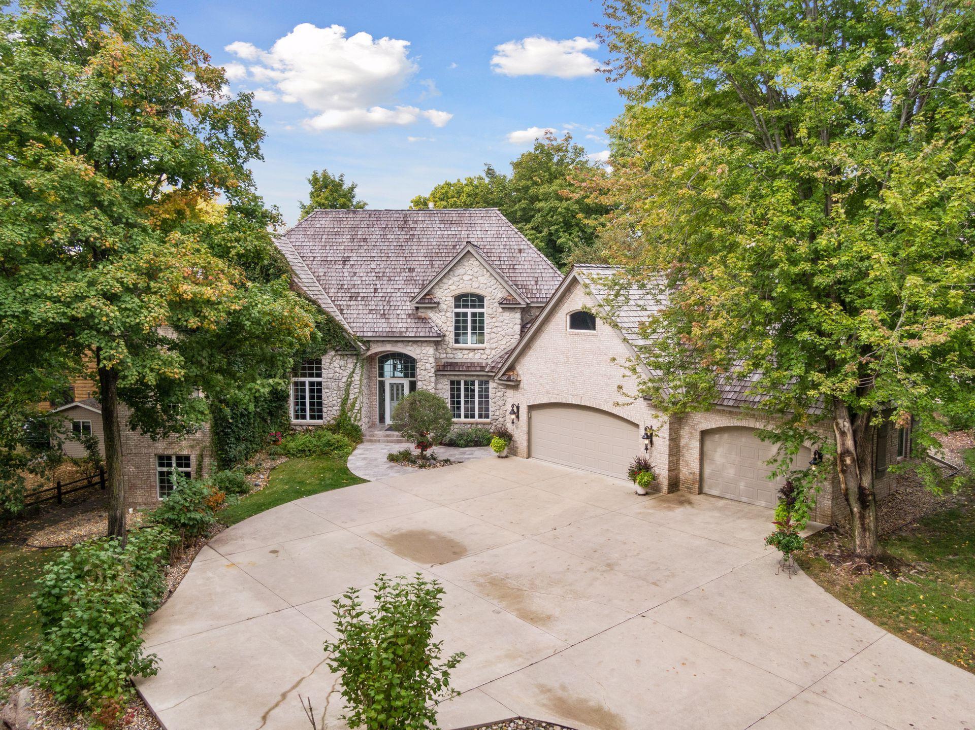 Welcome to 10836 Indian Beach Road, Spicer, MN 56288! An executive-style estate on the water, boasting 5,400sf living space, a finished/heated showcase 6-stall garage. Tennis court, and expansive grounds shared with two other private residences.