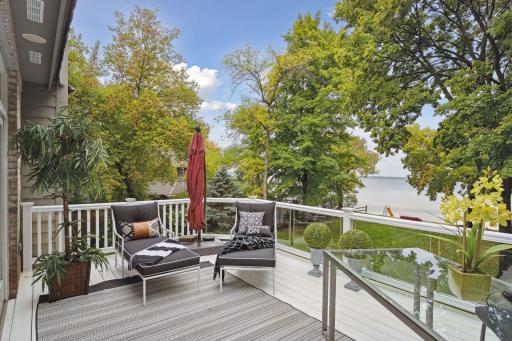 Maintenance free deck with glass panes for an unobstructed view of the backyard. Fabulous outdoor space to entertain, lounge or work remotely while catching some fresh air. Must-have indoor/outdoor speaker system. Deck walks down to backyard.