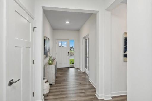 Make the best first impression with this bright and open foyer. (Photo of decorated model, actual home's finishes may vary slightly)