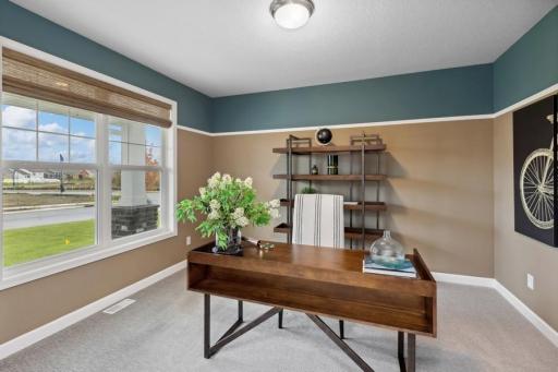 Another view of the spacious study. (Photo of decorated model, actual home's finishes may vary slightly)