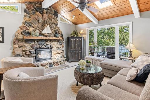 The rock fireplace adds to the cabin-like feel of this luxury home