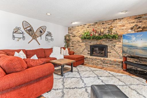 The lower level family room also includes a fireplace, perfect for cozying up on cold winter days