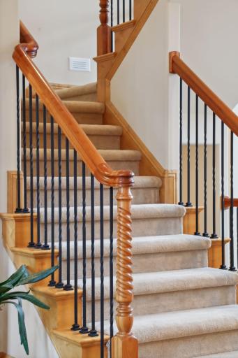 The open staircase invites you to head upstairs!
