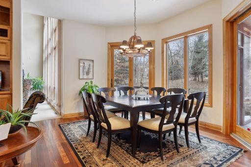 Enjoy meals in the eat-in dining space overlooking the screen porch and deck.