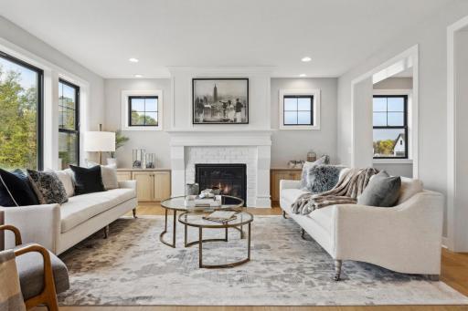 Stunning Architecture, Stunning Design! An open floor plan with inviting gathering room centered around a beautiful fireplace, custom-built-ins, an abundance of windows, and convenient resource room.