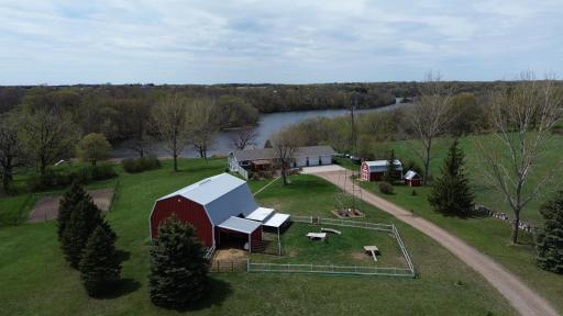 Welcome to this wonderful Zimmerman hobby farm. With 6+ acres, a lake view and plenty of outdoor living spaces you will be happy to come home here every night to put your feet up and enjoy.