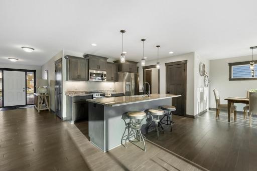 Gourmet kitchen with center island and breakfast bar