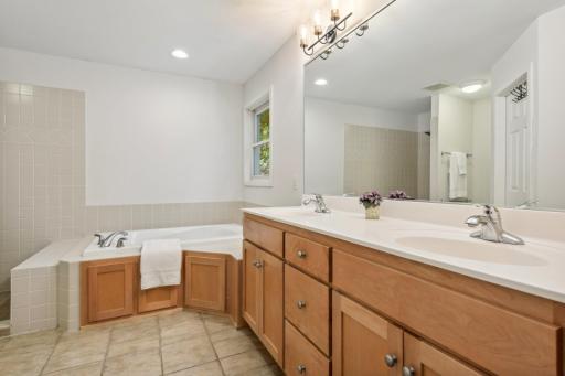 Owner's bathroom has double sinks, jetted tub, separate walk-in shower, & oversized walk-in closet.