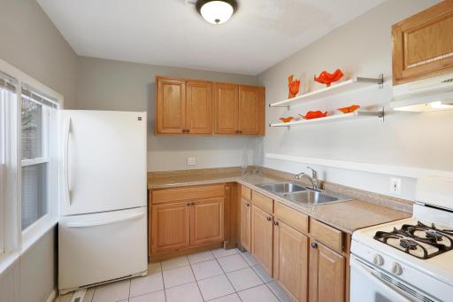 Cute kitchen with tile floors, gas stove and nice amounts of counter space.