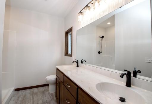 Double vanity & big linen in the private bath.jpg