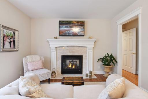 Main floor primary sitting area with gas fireplace